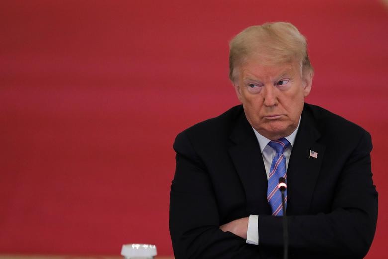 U.S. President Donald Trump listens during a meeting of the American Workforce Policy Advisory Board in the East Room at the White House in Washington. REUTERS/Carlos Barria
